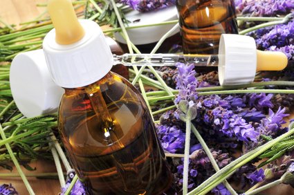 aromatherapy oil and lavender flowers